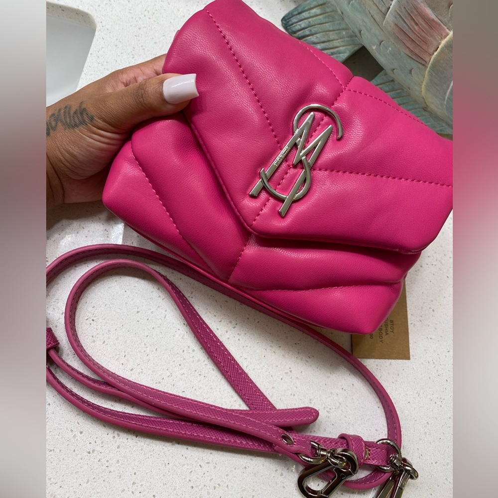 Pink Steven madden purse.